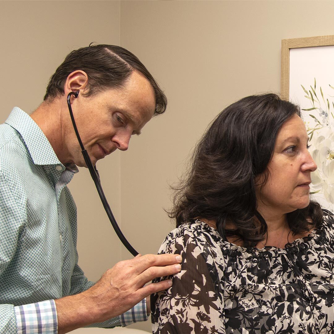 Aaron-Hartman-MD-With-Patient